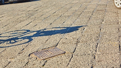 Image showing shadow of cyclist during sunset, 