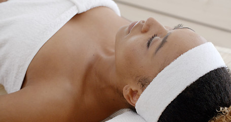 Image showing Woman Relaxing On A Lounger With Eyes Closed