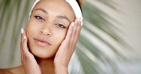 Image showing Woman With Makeup Touching Her Face