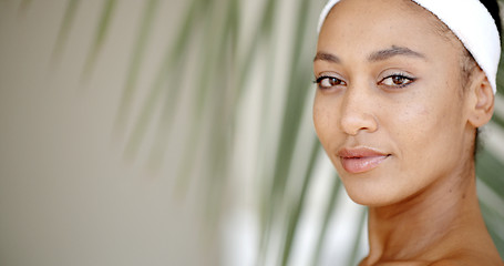 Image showing Young Adult Woman Touching Her Face