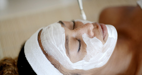 Image showing Cosmetician Applying Facial Mask