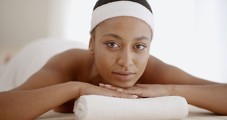 Image showing African Woman Laying On Spa Table