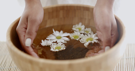 Image showing Female Hands With Bowl Of Aroma Water