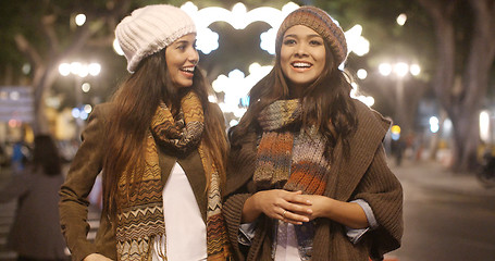 Image showing Two young woman enjoying a winter night out