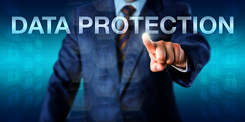 Image showing Manager Pushing DATA PROTECTION Onscreen