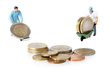 Image showing Two Miniature workers drives euro coins