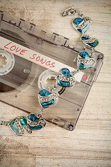 Image showing Audio cassette tape and bracelet