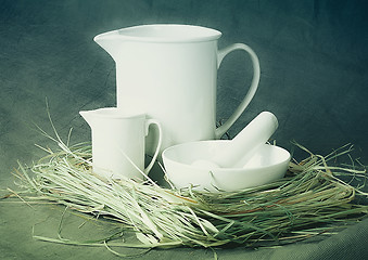 Image showing White porcelain set on a gray background