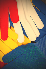 Image showing colored work gloves on the display