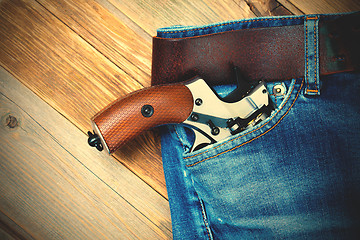 Image showing silver revolver in the pocket