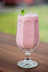 Image showing Strawberry smoothie on  table