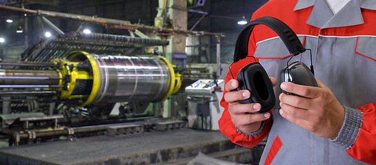 Image showing Worker with protective headphone