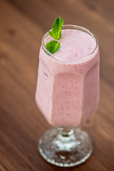 Image showing Strawberry smoothie on  table