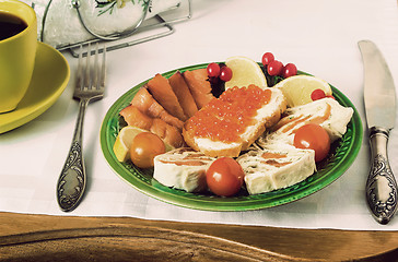 Image showing Snacks with fish and black coffee.