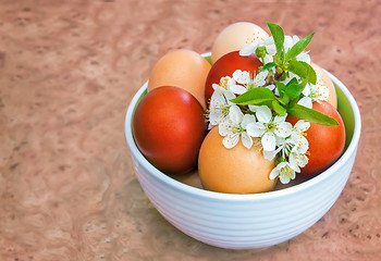 Image showing Easter eggs on the table in a ceramic vase.