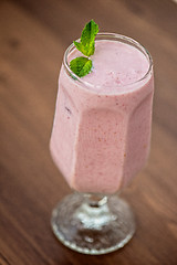 Image showing Strawberry smoothie on  table