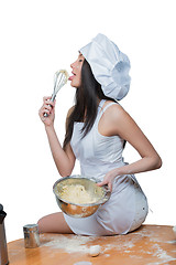 Image showing sexy woman in chef uniform knead the dough