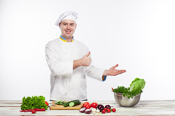 Image showing Chef cooking fresh vegetable salad in his kitchen