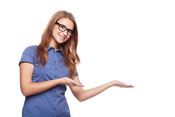 Image showing Smiling business woman showing open hand palm