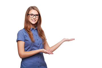 Image showing Smiling business woman showing open hand palm