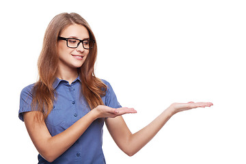 Image showing Smiling business woman showing open hand palm