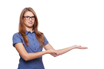 Image showing Smiling business woman showing open hand palm