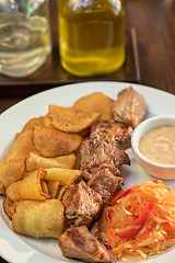 Image showing Grilled pork, baked potatoes
