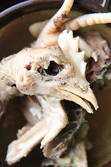 Image showing chicken head and leg as food