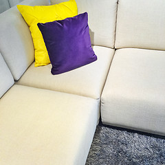 Image showing White corner sofa with colorful cushions