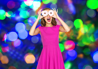 Image showing happy woman or teen girl having fun with donuts