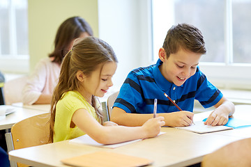 Image showing group of school kids writing test in classroom