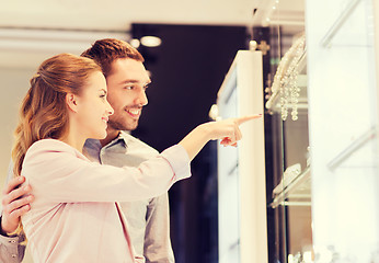 Image showing couple looking to shopping window at jewelry store