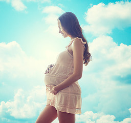 Image showing happy pregnant woman in chemise