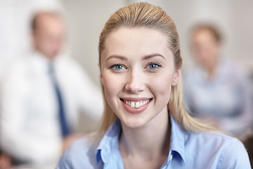 Image showing group of smiling businesspeople meeting in office