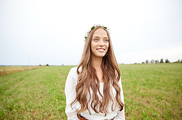 Image showing smiling young hippie woman on cereal field