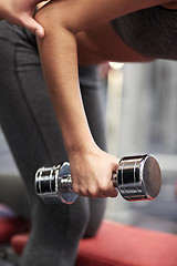 Image showing close up of couple with dumbbell exercising in gym