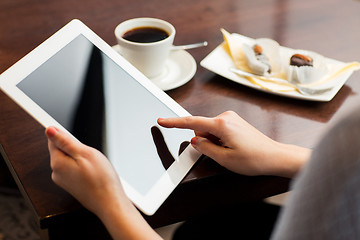 Image showing close up of woman with tablet pc and coffee