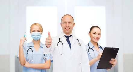 Image showing group of doctors at hospital showing thumbs up