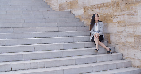 Image showing Business woman sitting with crossed legs