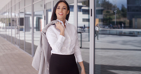 Image showing Business woman with jacket over shoulder