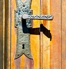 Image showing castellanza blur  brown knocker in a  door c  wood italy   cross