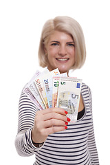 Image showing Smiling woman holding a handful of Euro notes