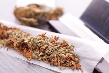 Image showing Dried Cannabis on Rolling Paper with Filter