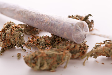 Image showing Close up of dried marijuana leaves and joint