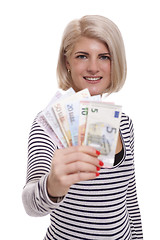 Image showing Smiling woman holding a handful of Euro notes