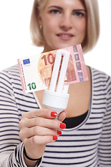 Image showing Woman holding an eco-friendly light bulb