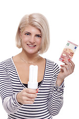 Image showing Woman holding an eco-friendly light bulb