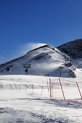 Image showing Gondola lift on ski resort at windy sun day