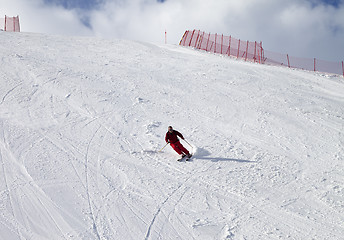 Image showing Skier on ski slope at sun day