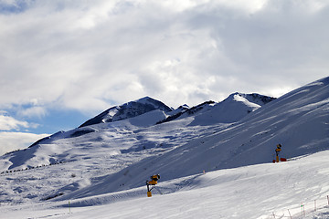 Image showing Ski slope with snowmaking at evening